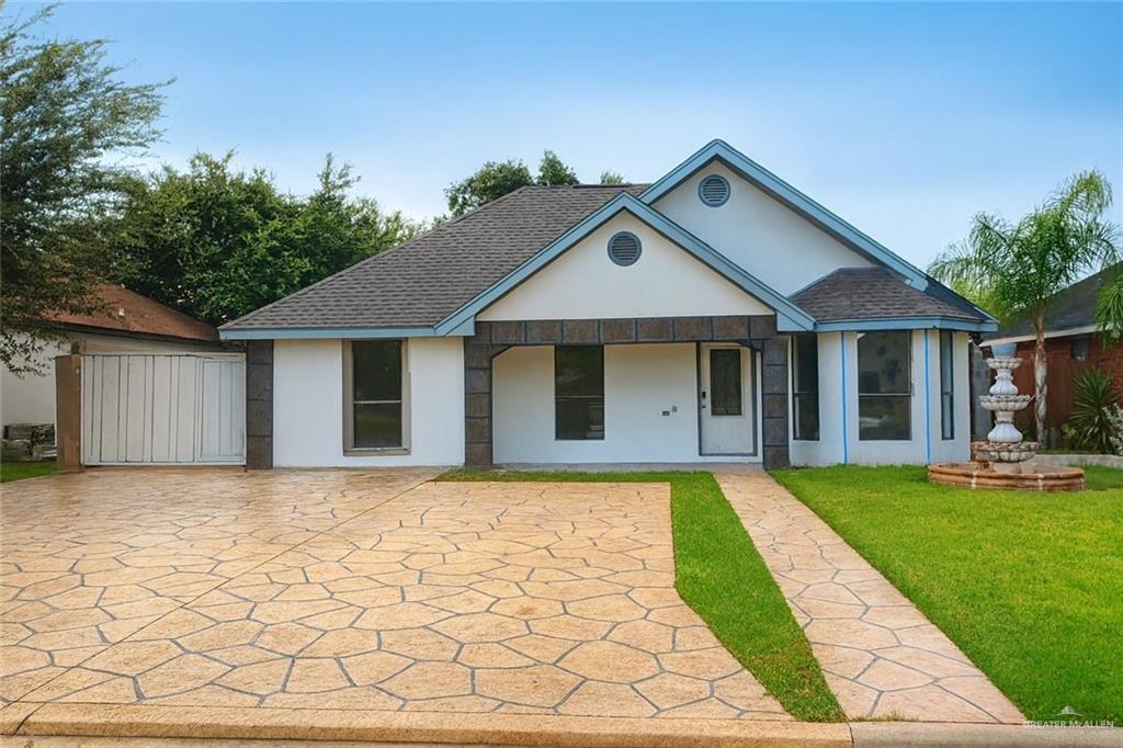 2114 Monterrey Hidalgo, TX 78557 - Photo 1 of 1 a front view of a house with a yard