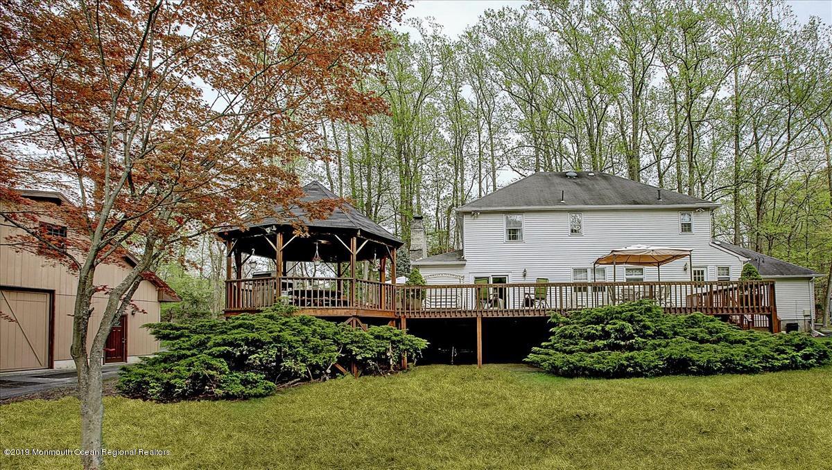 111 Reids Hill Road Morganville, NJ 07751 - Photo 38 of 39 a front view of a house with garden