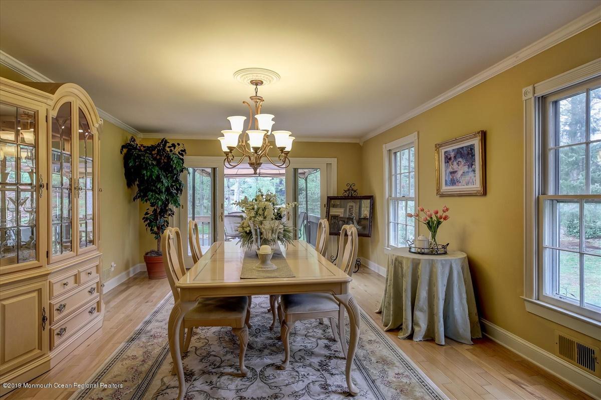 111 Reids Hill Road Morganville, NJ 07751 - Photo 39 of 39 a view of a dining room with furniture window and wooden floor