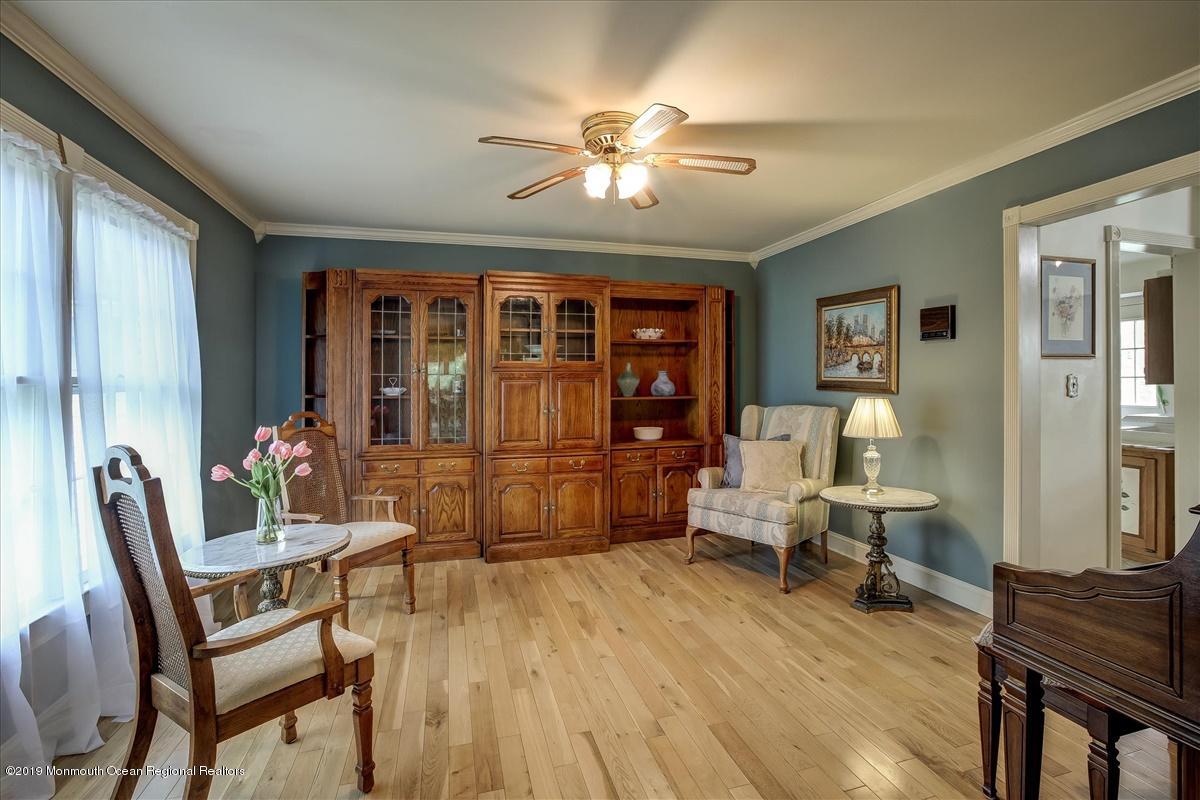 111 Reids Hill Road Morganville, NJ 07751 - Photo 7 of 39 a living room with furniture and a large window