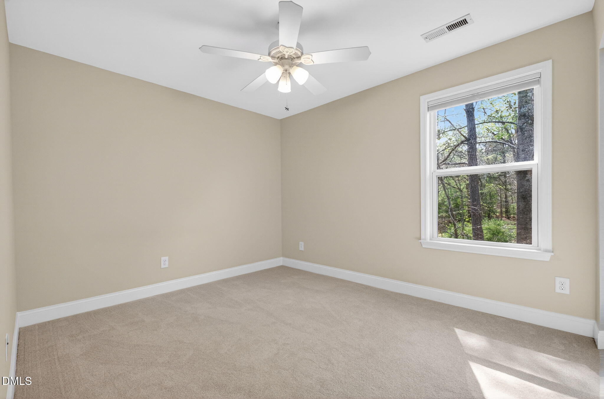 1304 Barnford Mill Road Wake Forest, NC 27587 - Photo 36 of 44 an empty room with windows and chandelier fan