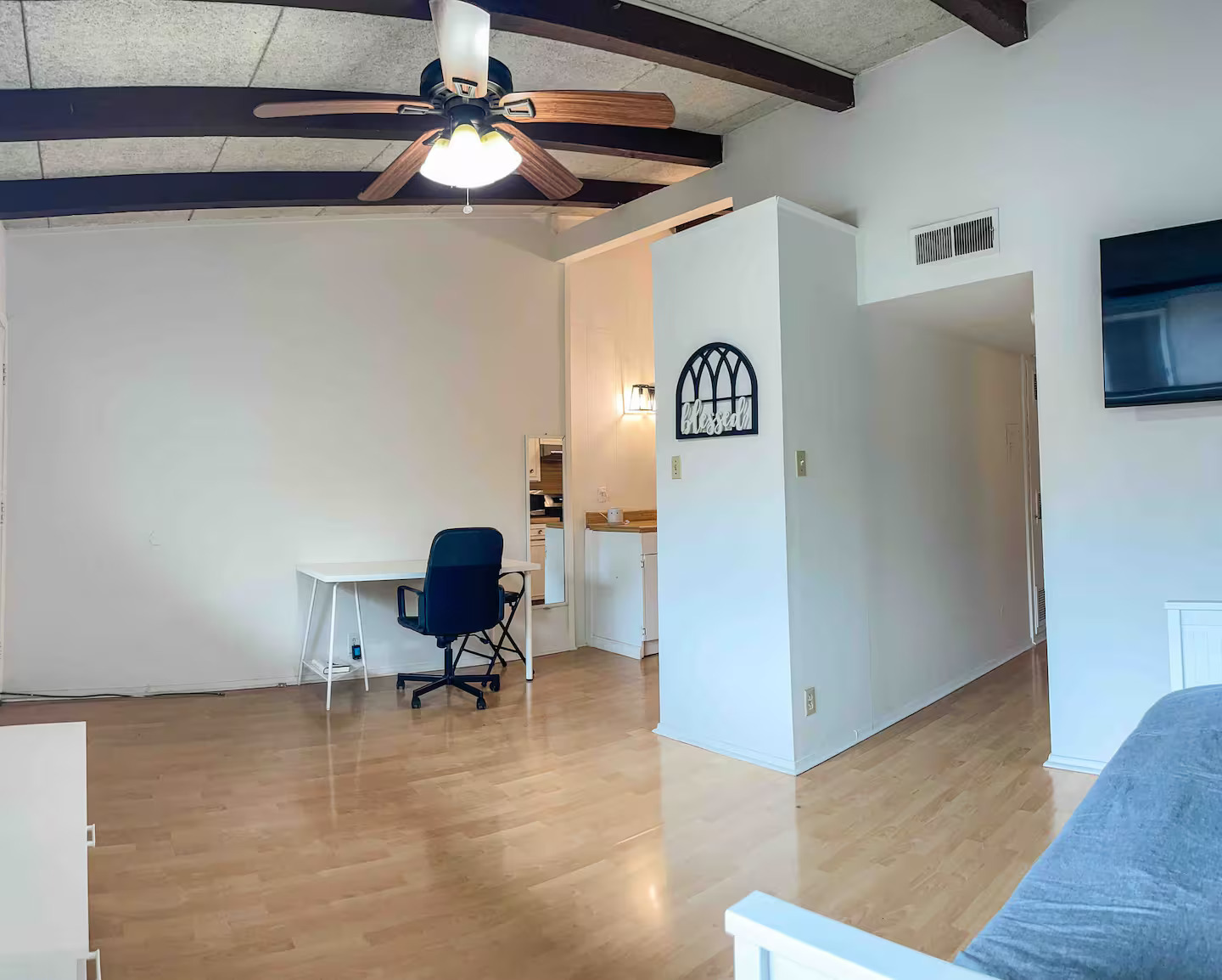 2404 Longview Street, Unit 204 Austin, TX 78705 - Photo 4 of 9 Home office with light wood finished floors, ceiling fan, and beamed ceiling