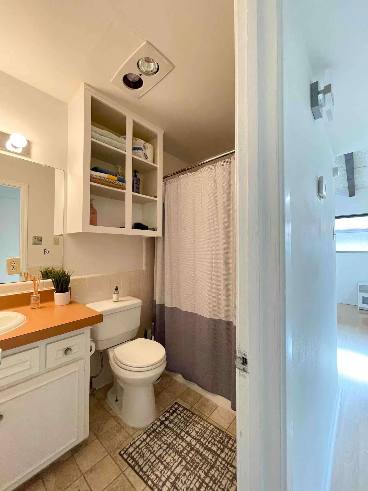 2404 Longview Street, Unit 204 Austin, TX 78705 - Photo 5 of 9 Bathroom with a shower with curtain, vanity, and light tile patterned floors