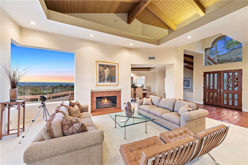 a living room with furniture ceiling fan and a rug