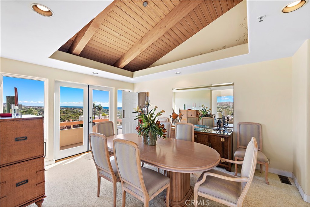 6 Marana San Clemente, CA 92673 - Photo 18 of 69 a dining room with furniture a potted plant and wooden floor