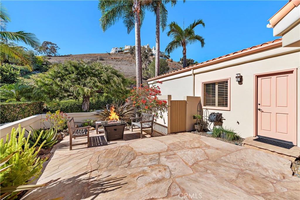 6 Marana San Clemente, CA 92673 - Photo 35 of 69 a view of a terrace with chairs and potted plants