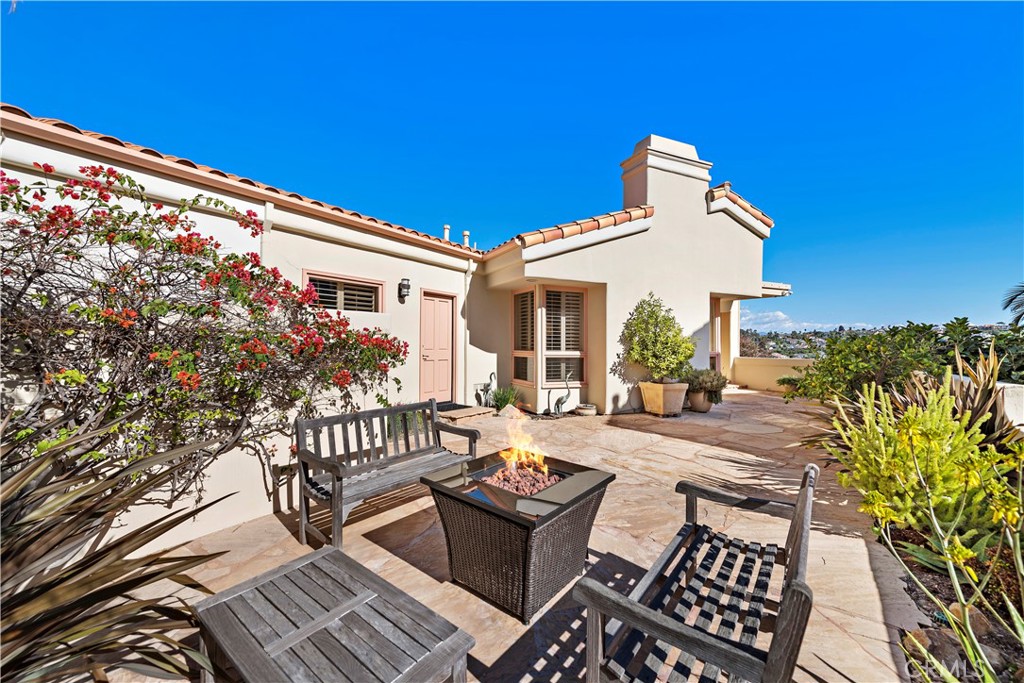 6 Marana San Clemente, CA 92673 - Photo 37 of 69 a view of a patio with couches table and chairs and potted plants