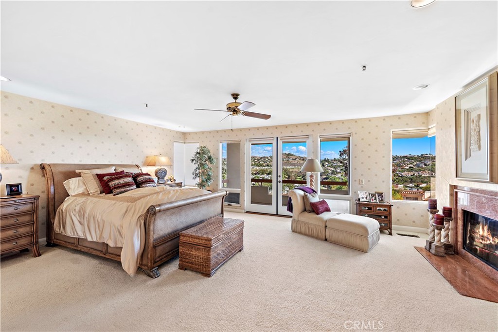 6 Marana San Clemente, CA 92673 - Photo 41 of 69 a spacious bedroom with a bed couch and large window