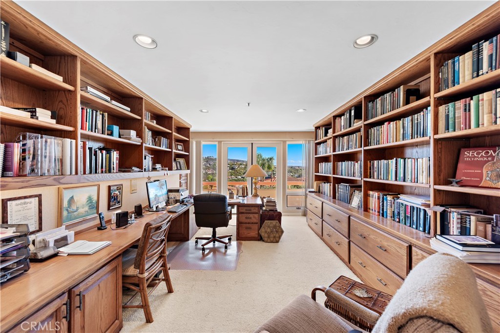 6 Marana San Clemente, CA 92673 - Photo 49 of 69 a living room with furniture lots of books and a large window