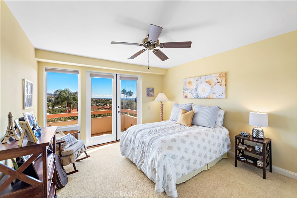 6 Marana San Clemente, CA 92673 - Photo 52 of 69 a bedroom with a bed and a chandelier