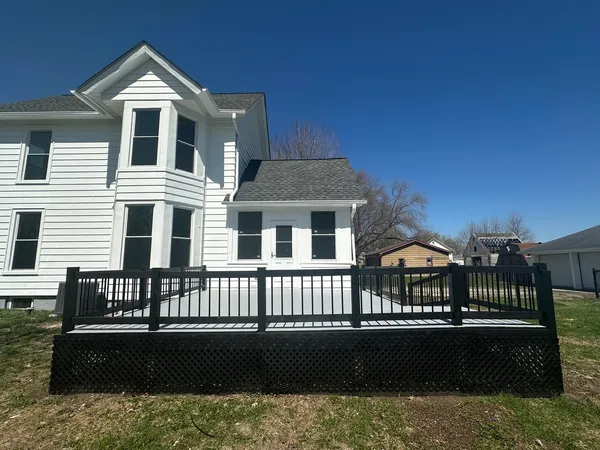 a front view of a house with yard and porch