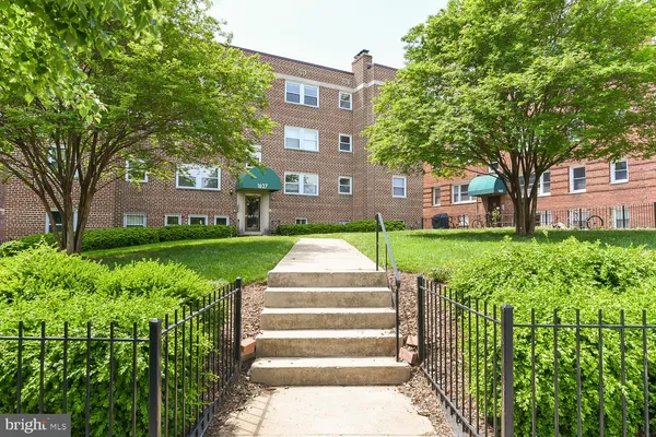 a front view of a building with garden