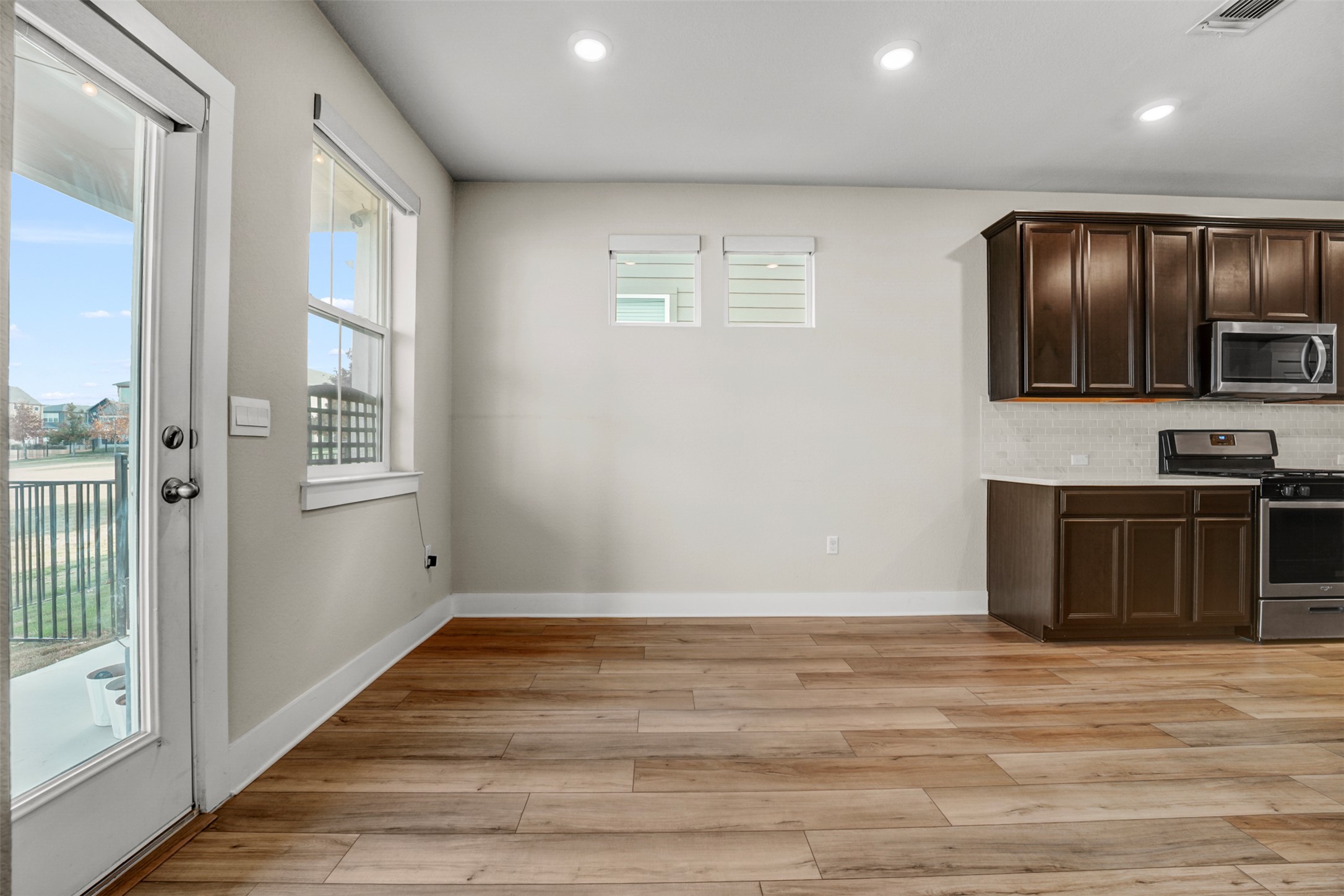 7509 Grand Linden Way, Unit 87 Austin, TX 78744 - Photo 11 of 30 a view of an empty room with a kitchen and a window