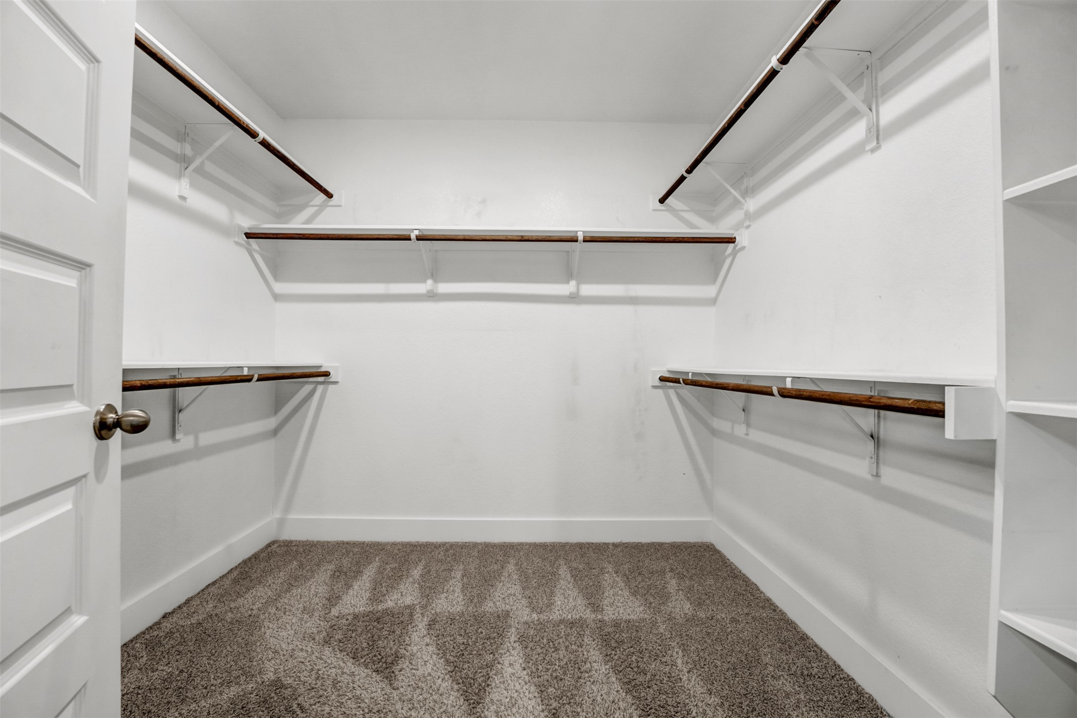 7509 Grand Linden Way, Unit 87 Austin, TX 78744 - Photo 18 of 30 a view of a room with racks on the wall