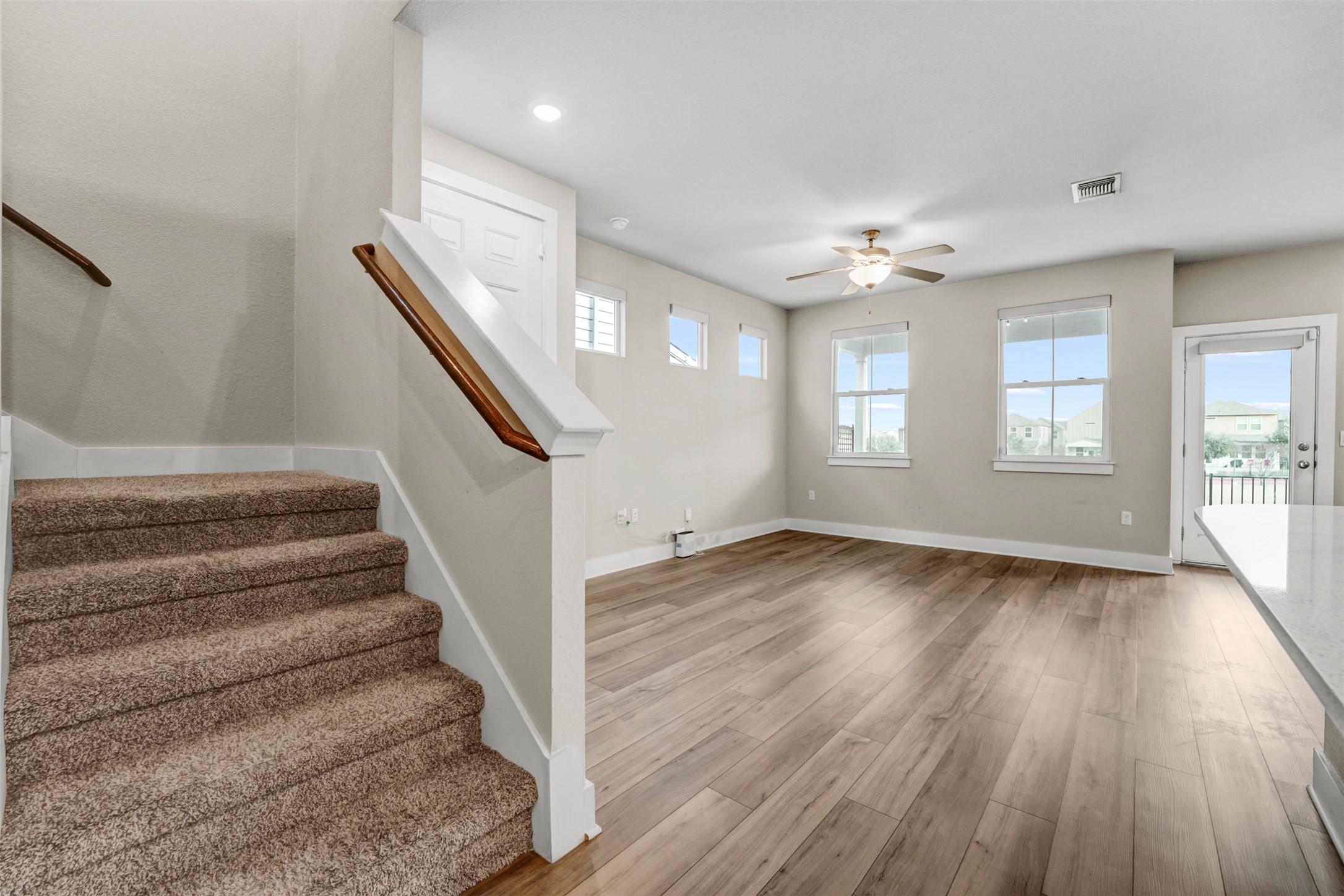 7509 Grand Linden Way, Unit 87 Austin, TX 78744 - Photo 4 of 30 wooden floor in an empty room with a window