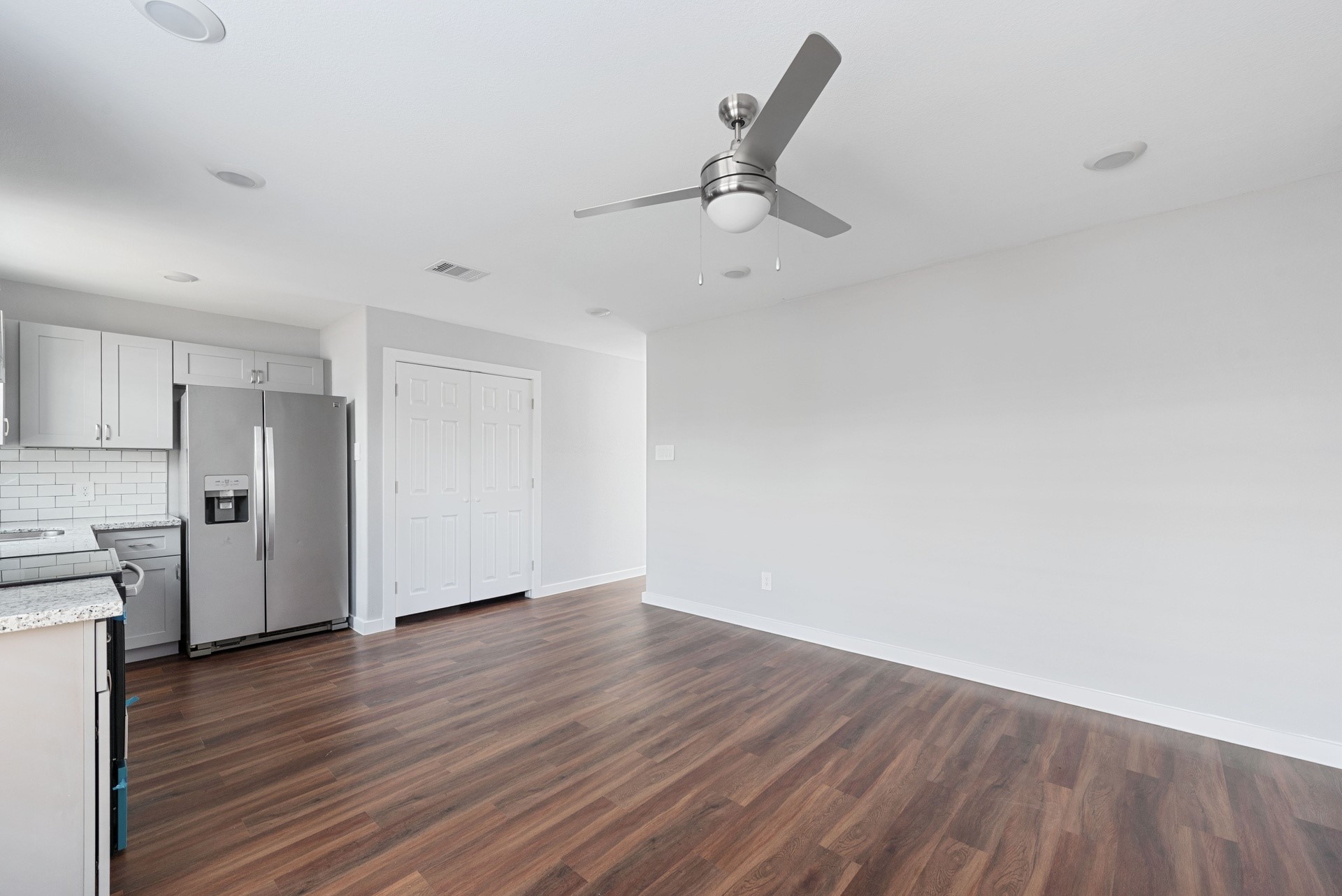 6809 Glass Street Houston, TX 77016 - Photo 17 of 29 a view of a kitchen with a sink and wooden floor