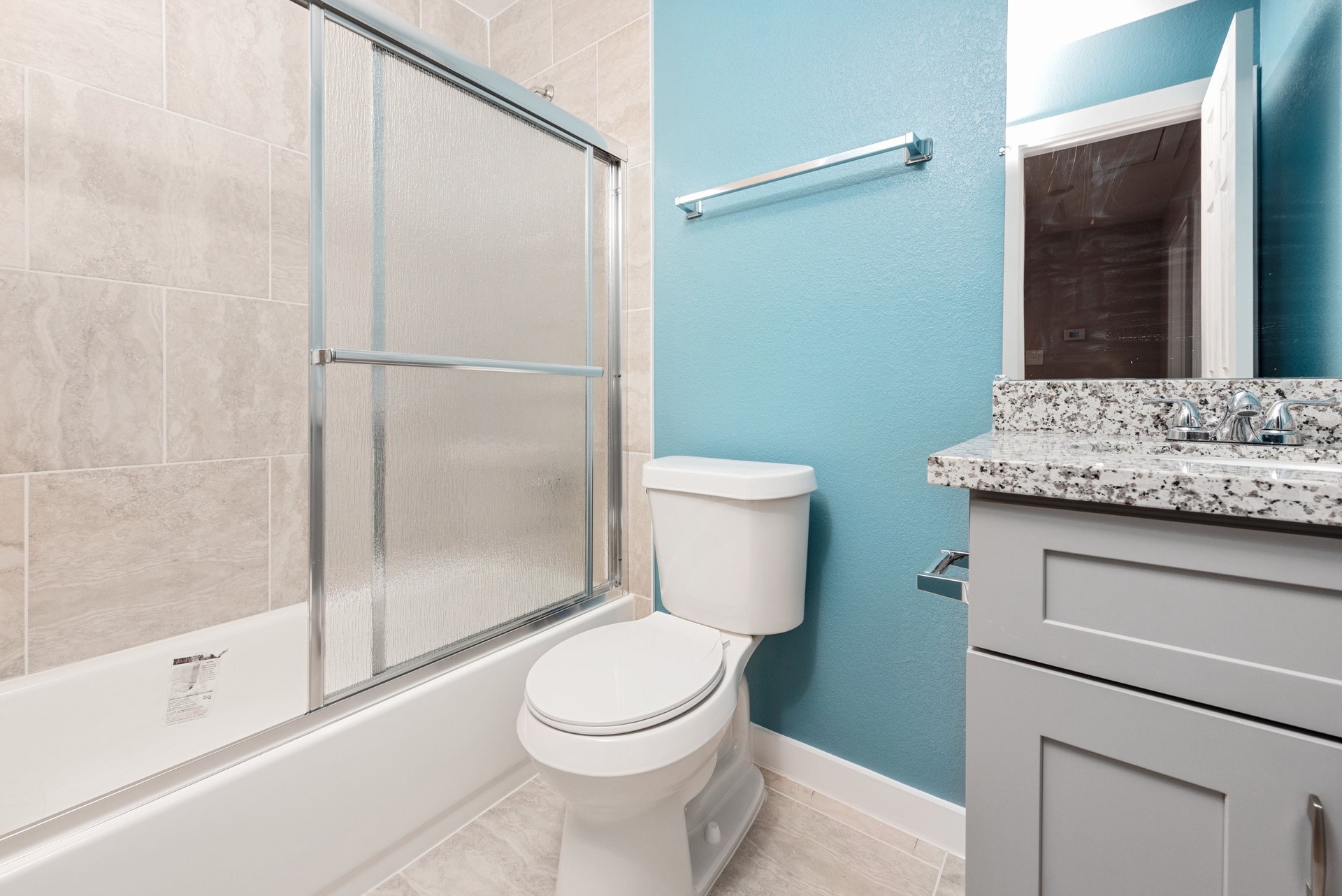 6809 Glass Street Houston, TX 77016 - Photo 23 of 29 a bathroom with a granite countertop sink toilet and shower