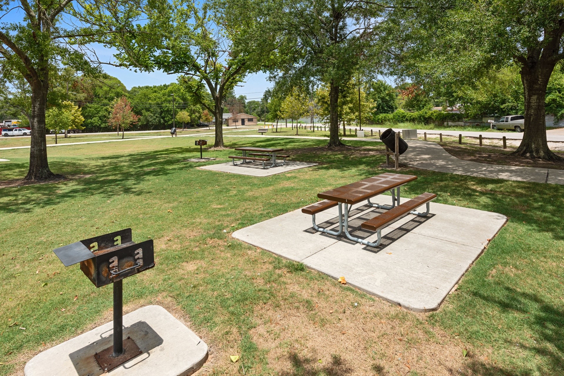 6809 Glass Street Houston, TX 77016 - Photo 25 of 29 a park view with a slide trees and wooden fence