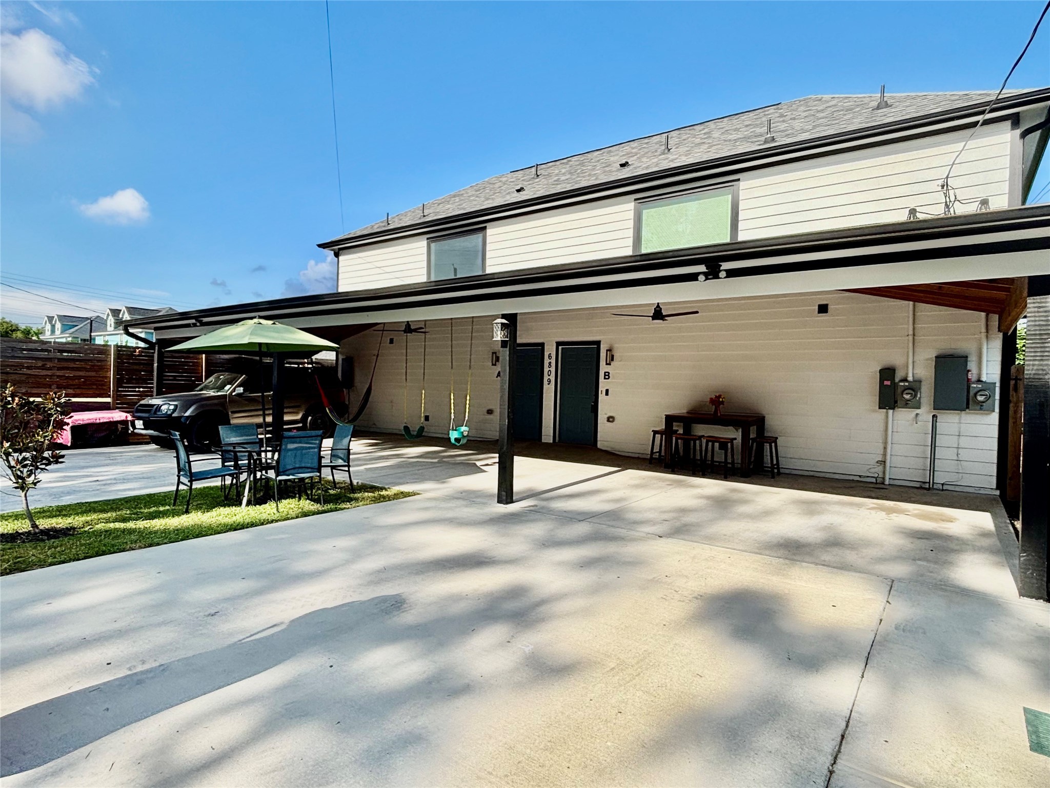 6809 Glass Street Houston, TX 77016 - Photo 4 of 29 a view of a chairs and tables in the back yard of the building