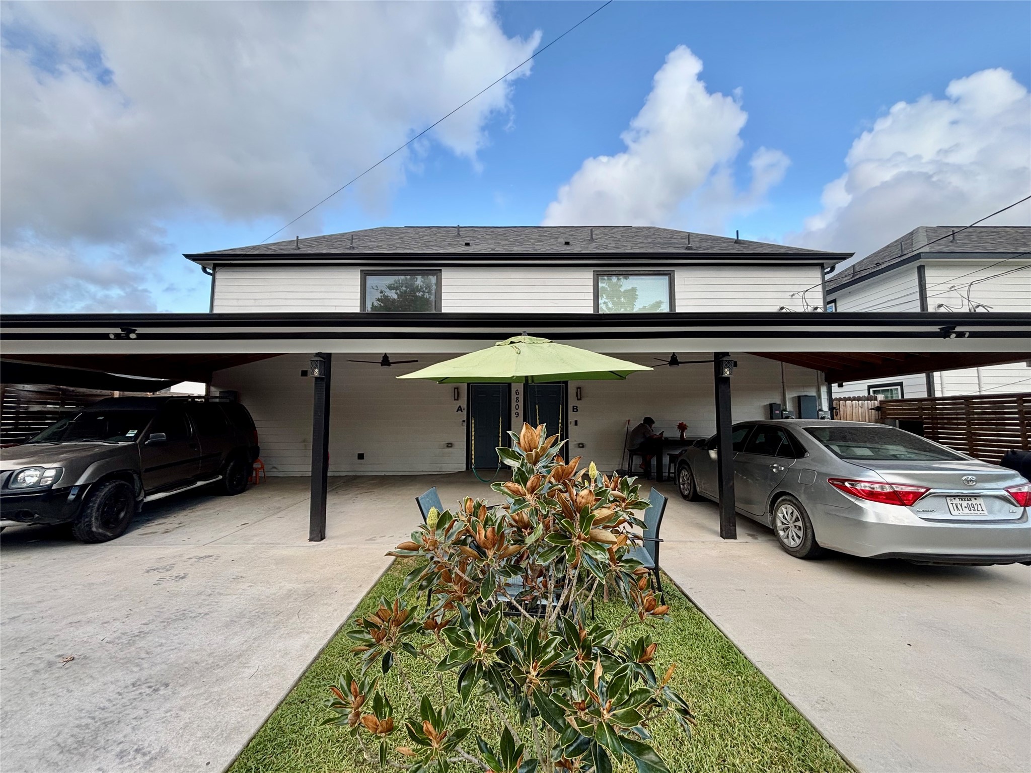 6809 Glass Street Houston, TX 77016 - Photo 6 of 29 a car parked in garage