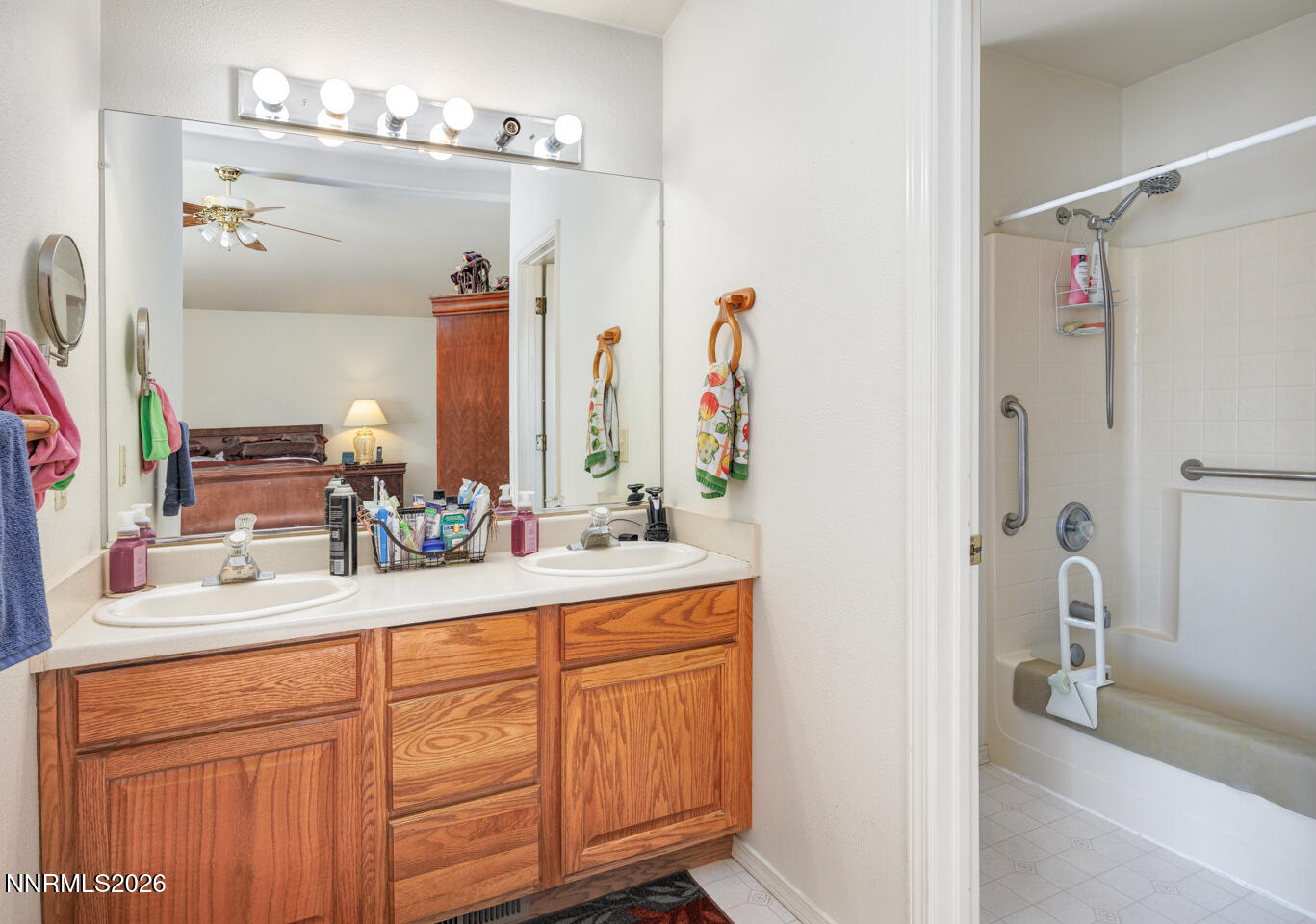 2100 Birch Lane Fallon, NV 89406 - Photo 14 of 27 a bathroom with a double vanity sink and a mirror