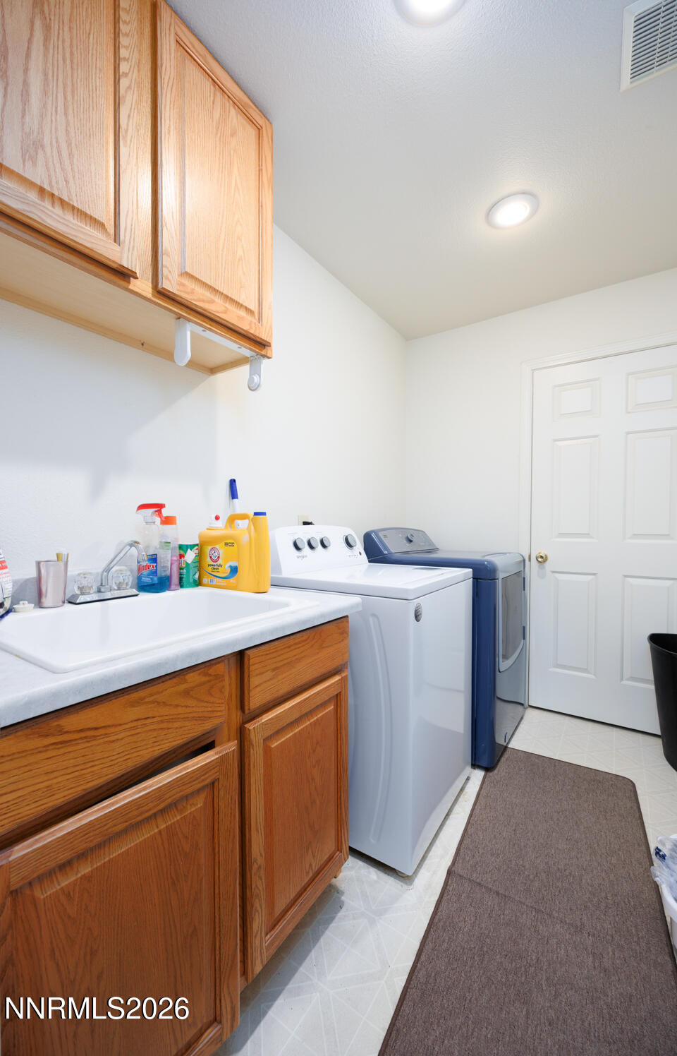 2100 Birch Lane Fallon, NV 89406 - Photo 16 of 27 a utility room with cabinets washer and dryer