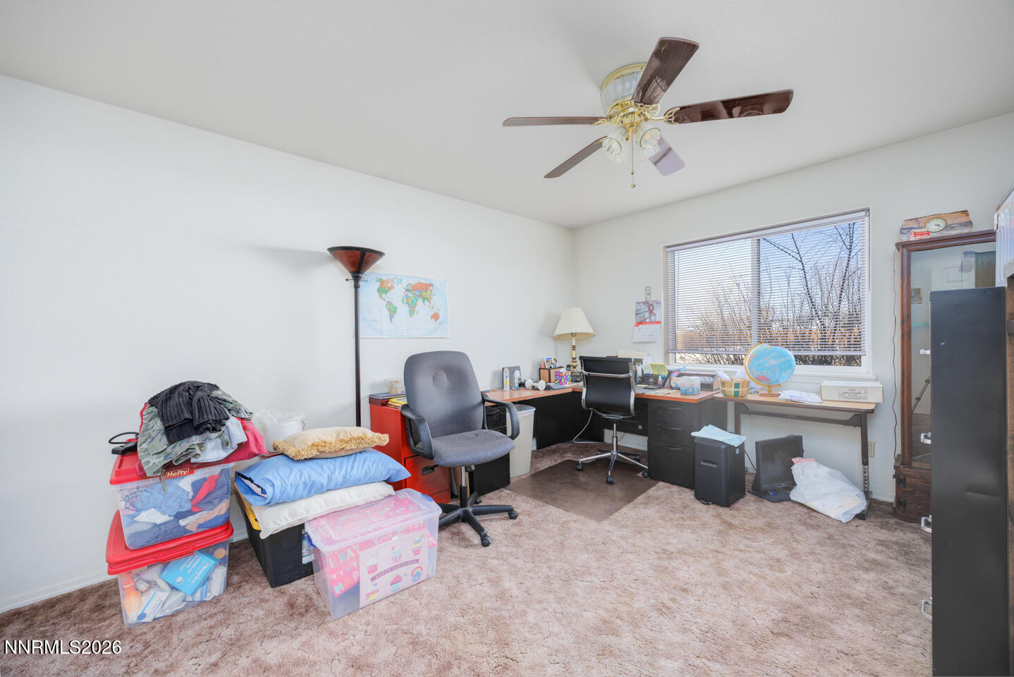 2100 Birch Lane Fallon, NV 89406 - Photo 10 of 27 a living room with furniture a window and gym equipment