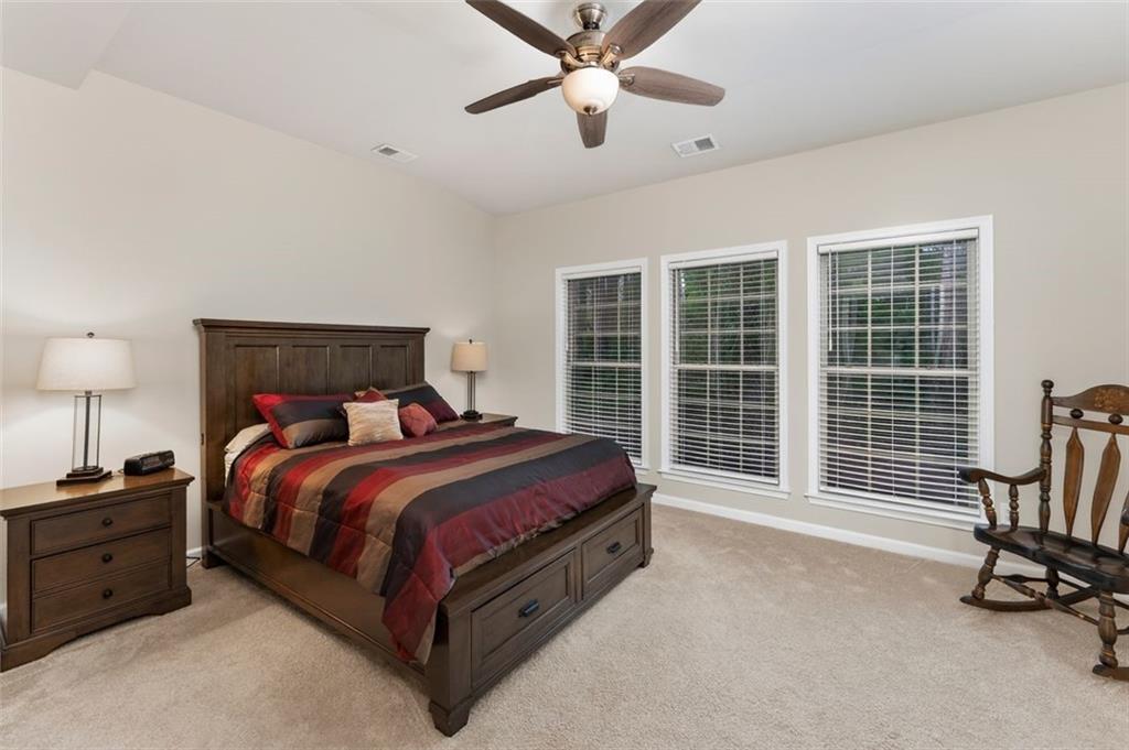 113 Tyson Woods Road Acworth, GA 30102 - Photo 20 of 37 a bed room with a bed and a desk