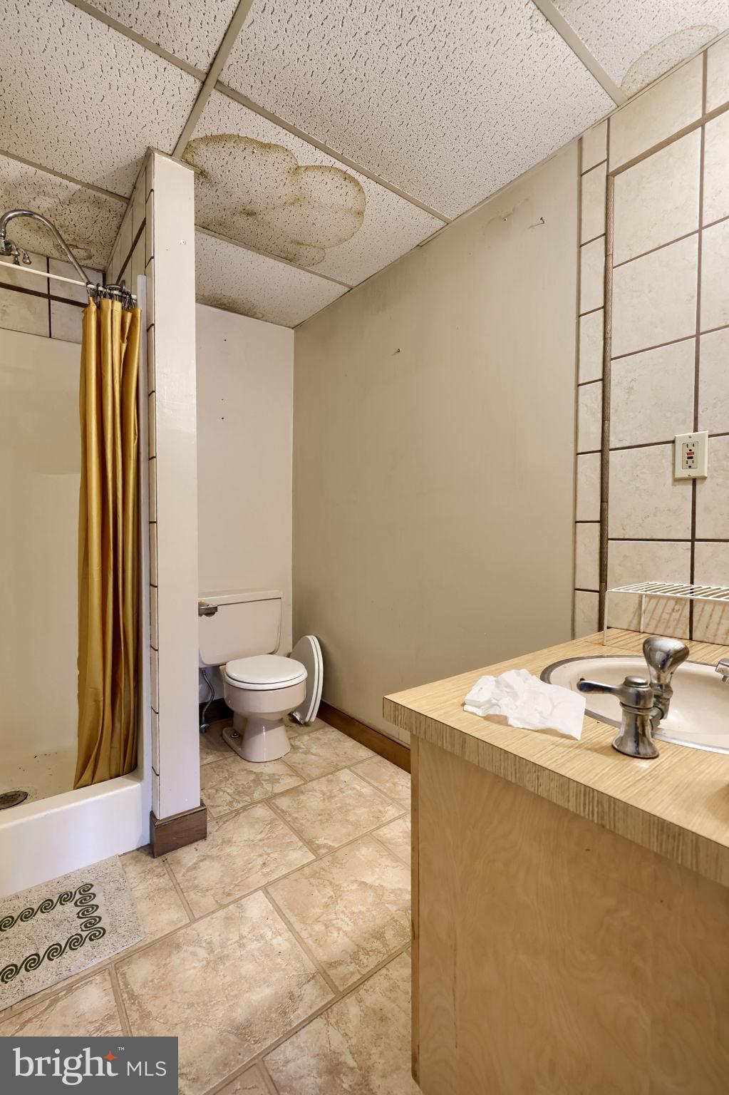 171 Fox Hollow Road Pequea, PA 17565 - Photo 25 of 28 a bathroom with a sink toilet and a shower
