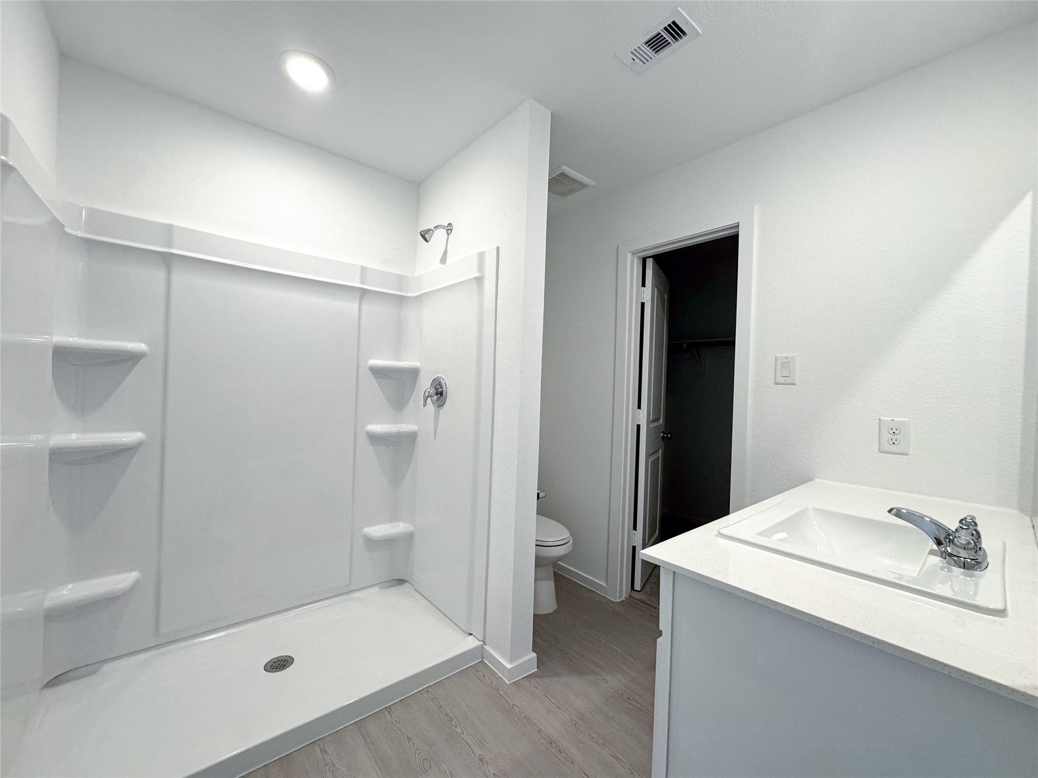 12431 Wild Strawberry Road Houston, TX 77038 - Photo 16 of 18 a bathroom with a sink and mirror
