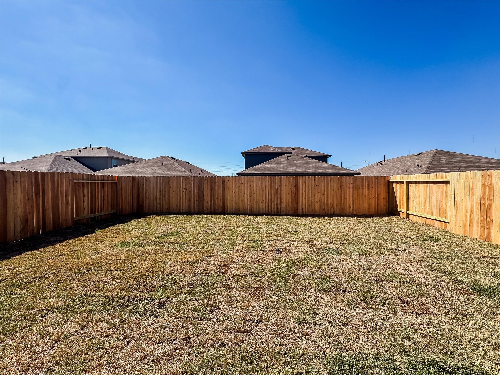 12431 Wild Strawberry Road Houston, TX 77038 - Photo 18 of 18 a view of a backyard with wooden fence
