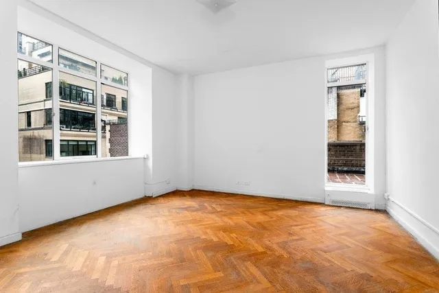 a bedroom with a large bed and furniture