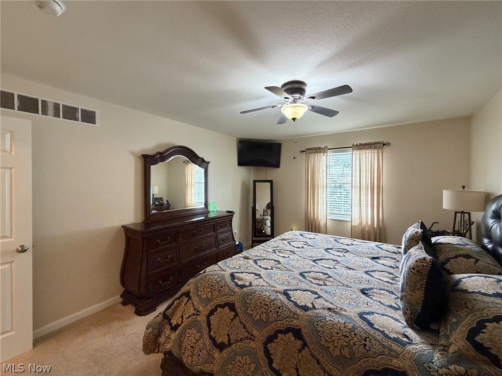 1343 Courtland Road Weirton, WV 26062 - Photo 22 of 50 Bedroom with a textured ceiling, a ceiling fan, and light carpet