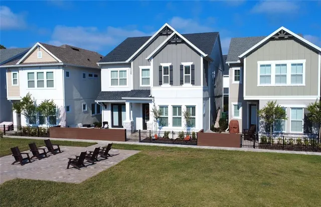 a front view of a house with a yard table and chairs