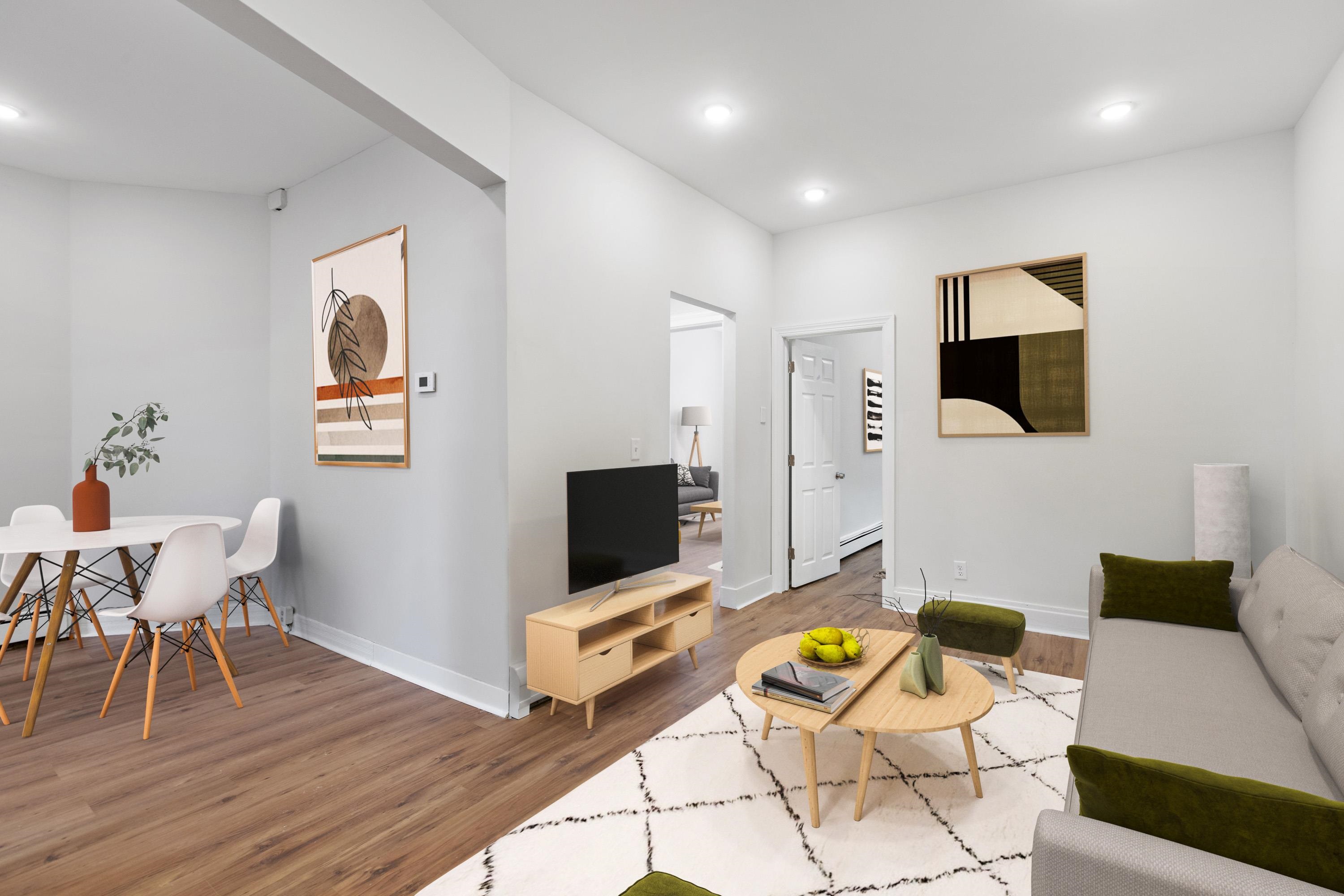 225 Pine Street, Unit 1 Jersey City, NJ 07304 - Photo 3 of 11 a living room with furniture and a flat screen tv