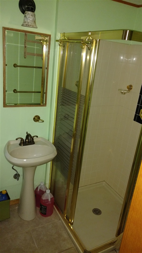 15716 Pine Street Truckee, CA 96161 - Photo 5 of 7 a bathroom with a sink and mirror