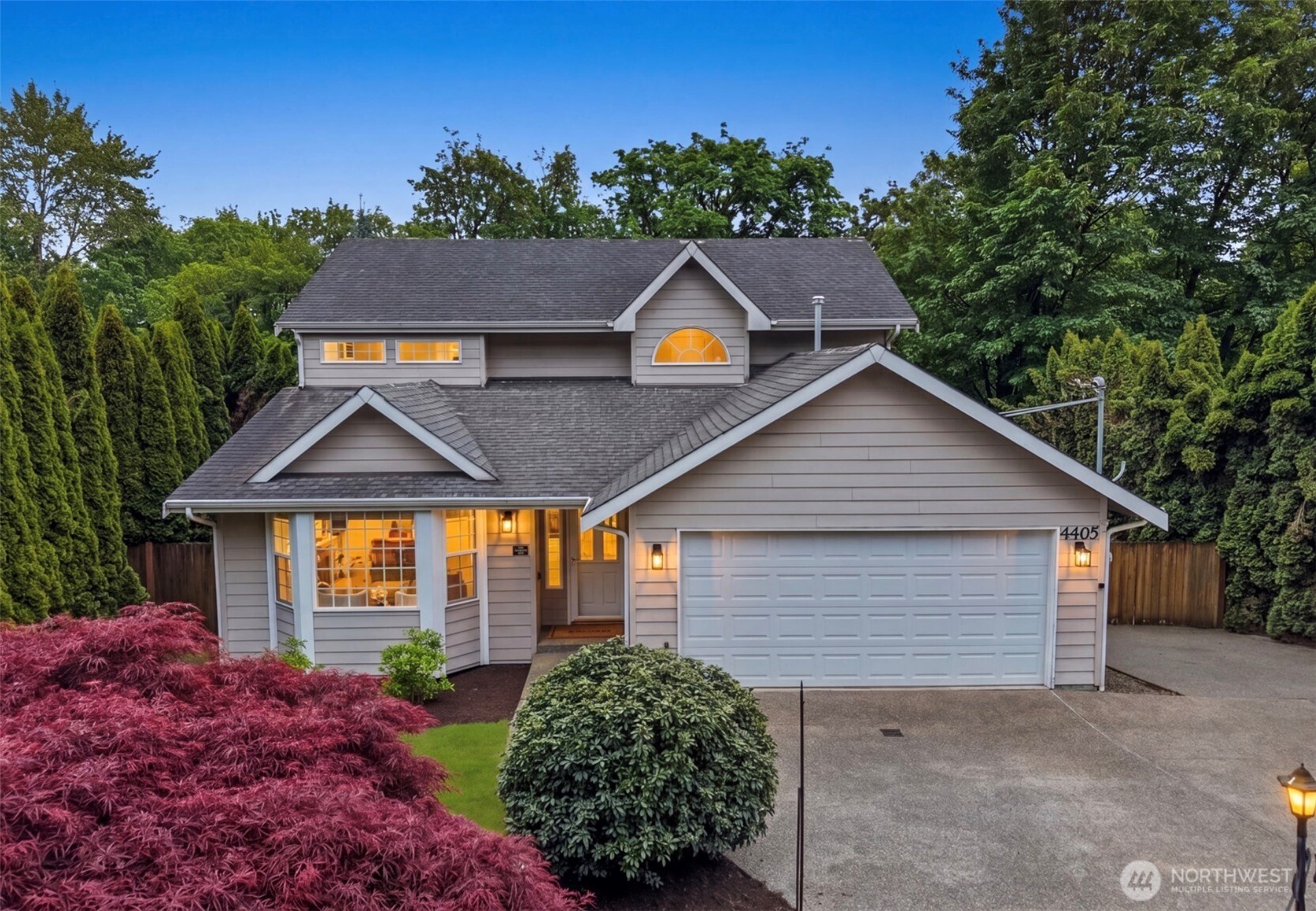4405 South 261st Street Kent, WA 98032 - Photo 1 of 31 a house with green field in front of it