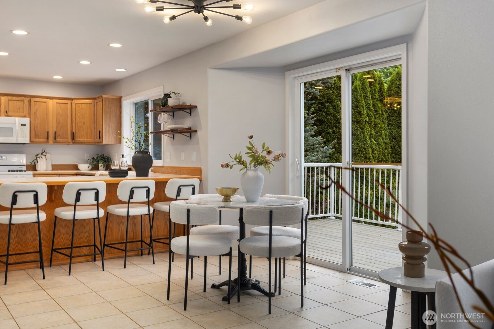 4405 South 261st Street Kent, WA 98032 - Photo 13 of 31 a dining room with furniture and a floor to ceiling window