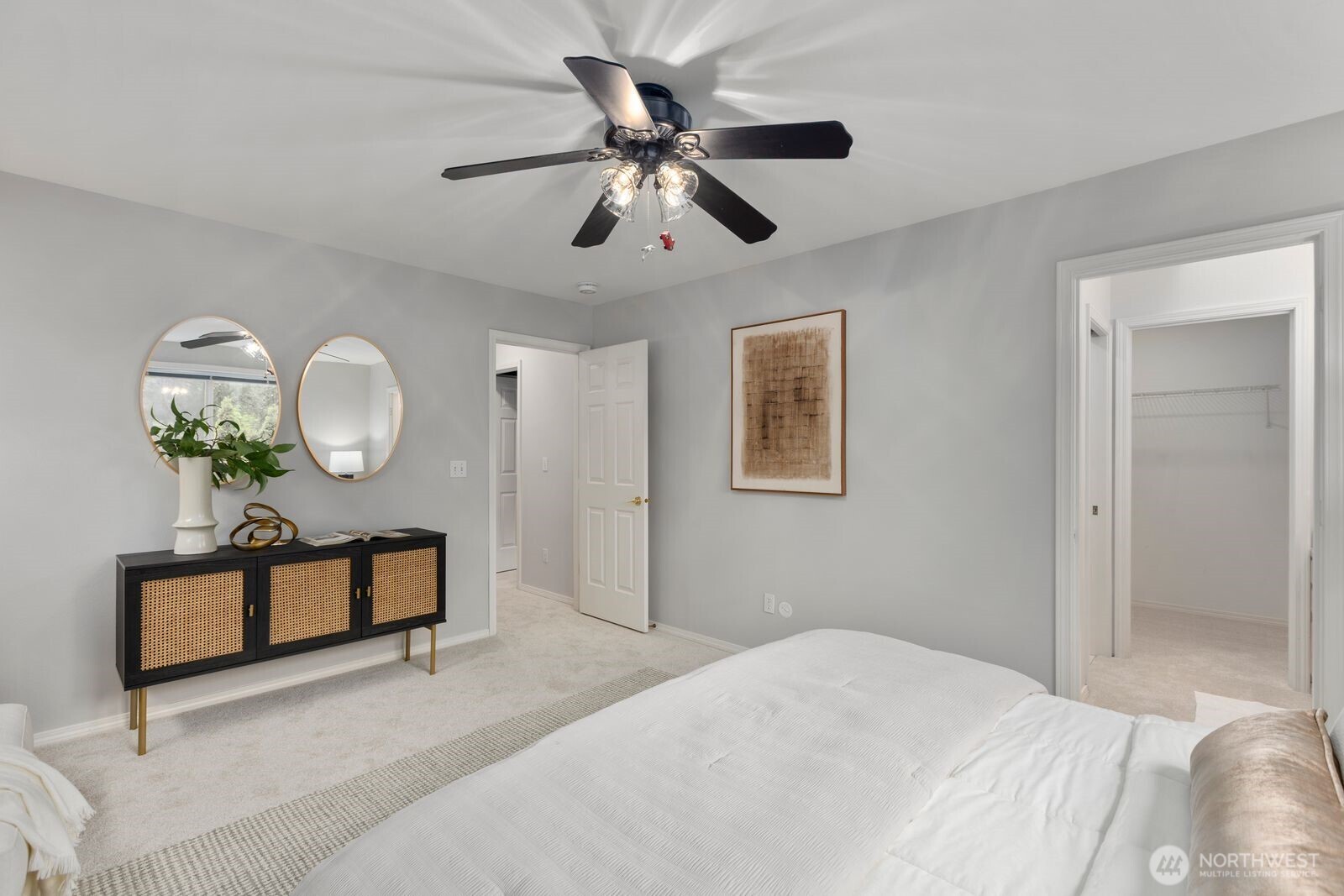 4405 South 261st Street Kent, WA 98032 - Photo 18 of 31 a bedroom with bed and a chandelier