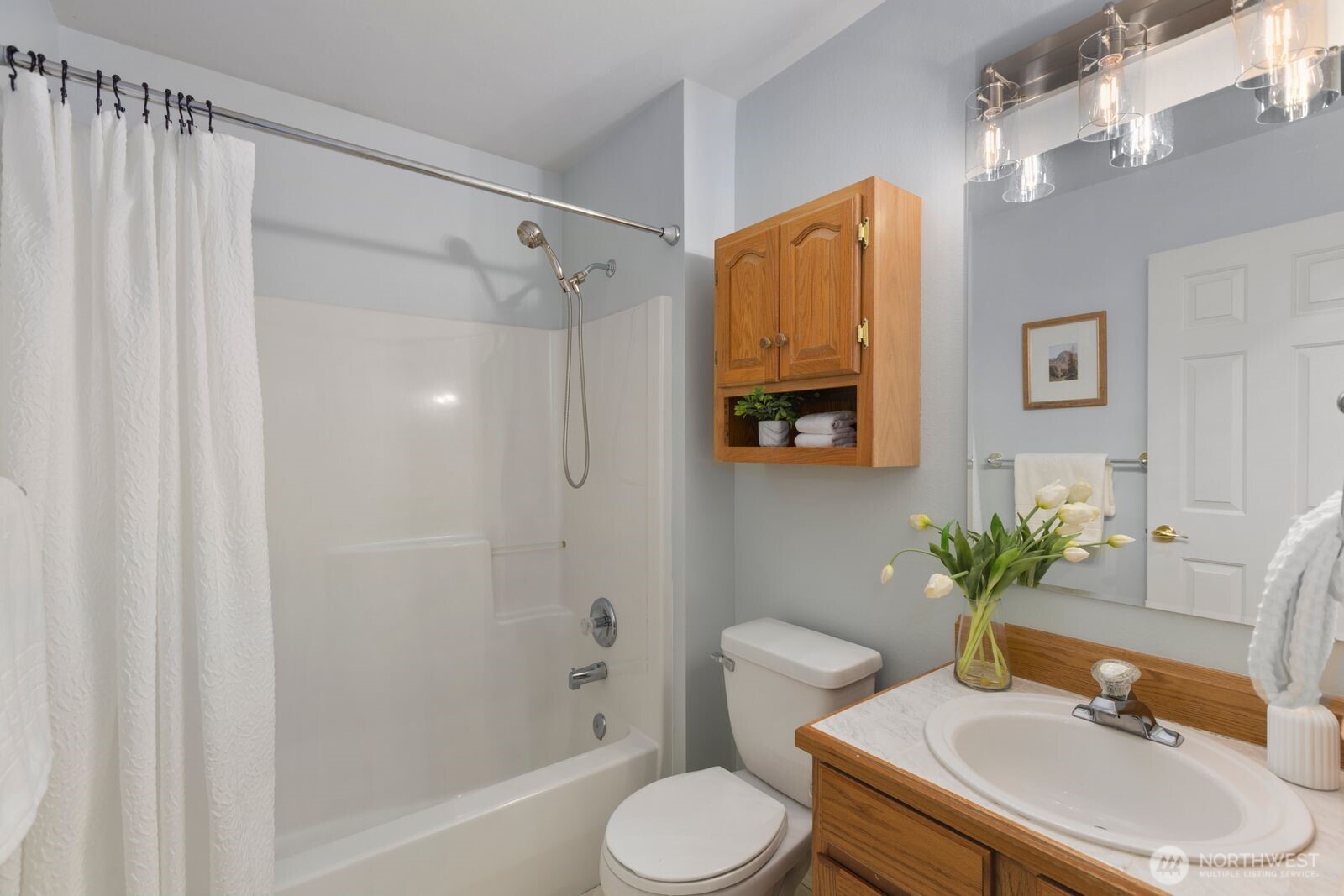 4405 South 261st Street Kent, WA 98032 - Photo 22 of 31 a bathroom with a sink toilet and shower
