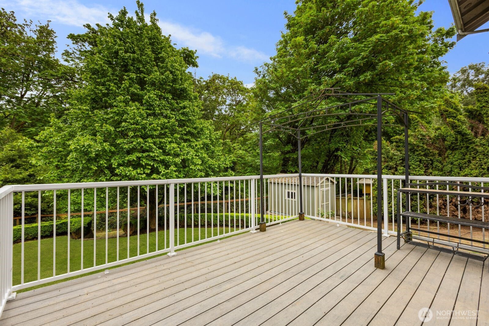 4405 South 261st Street Kent, WA 98032 - Photo 25 of 31 a view of balcony with wooden floor and fence