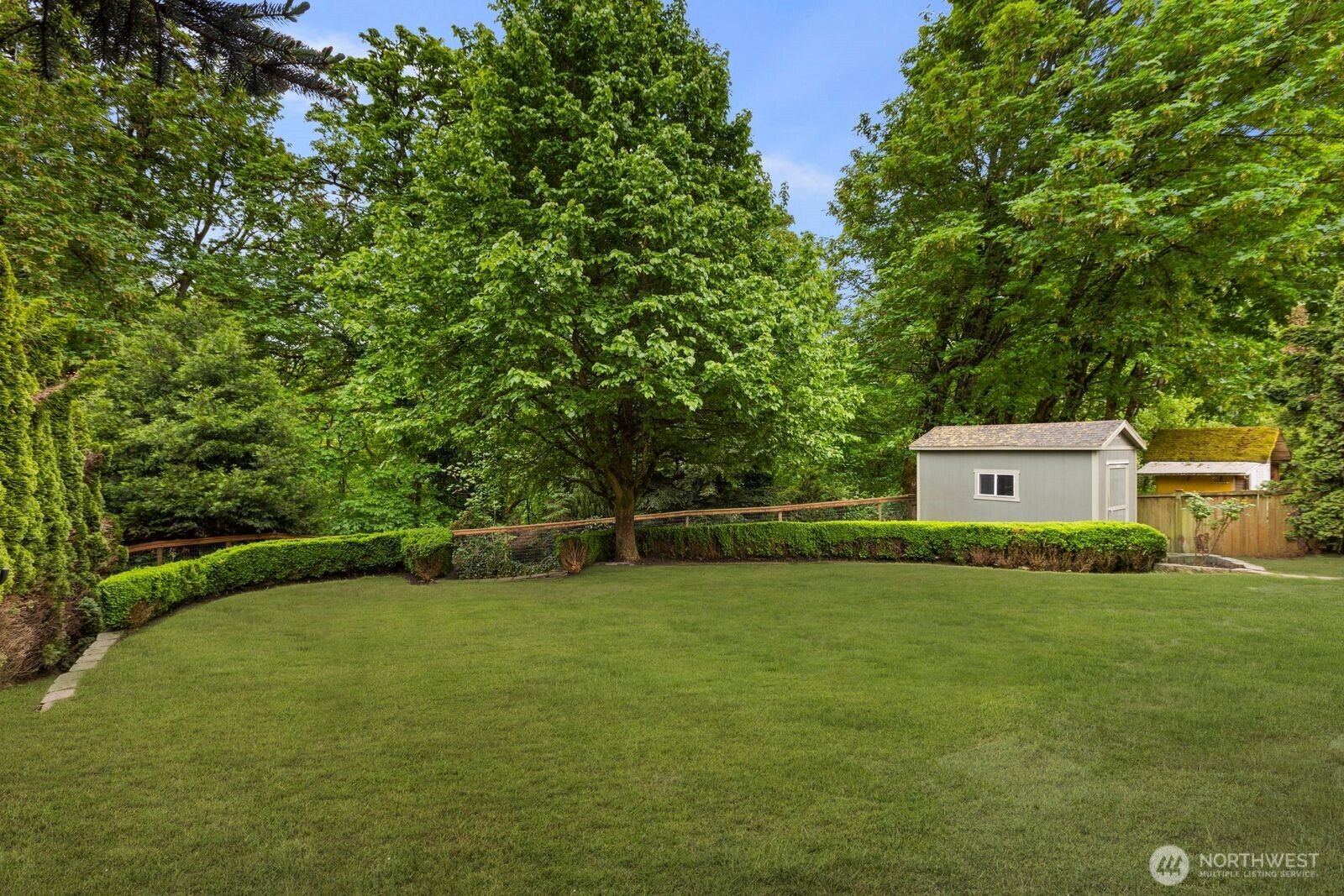 4405 South 261st Street Kent, WA 98032 - Photo 26 of 31 a view of a field with a tree
