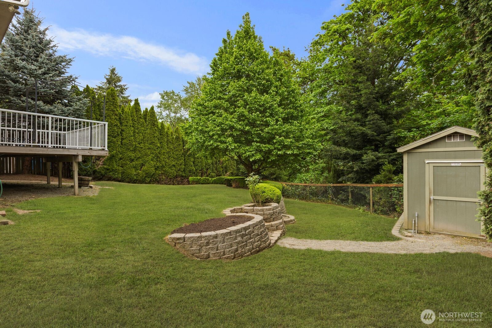 4405 South 261st Street Kent, WA 98032 - Photo 27 of 31 a view of a house with a backyard