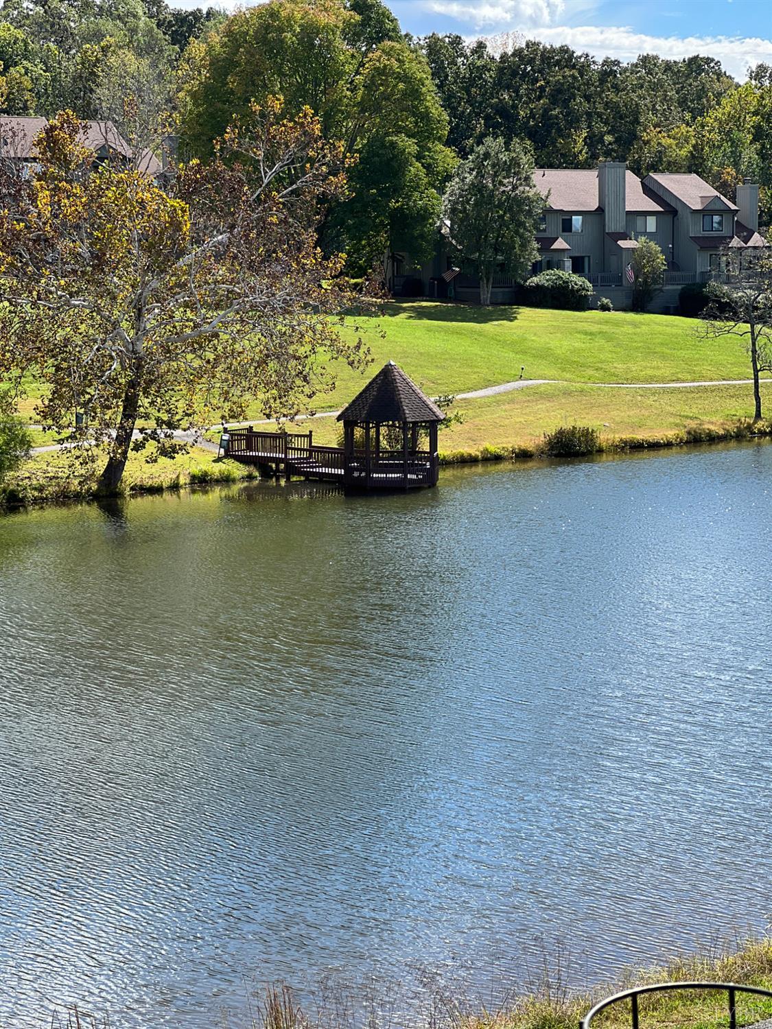 2212 Deer Run Forest, VA 24551 - Photo 17 of 38 a view of a lake with a houses in the background