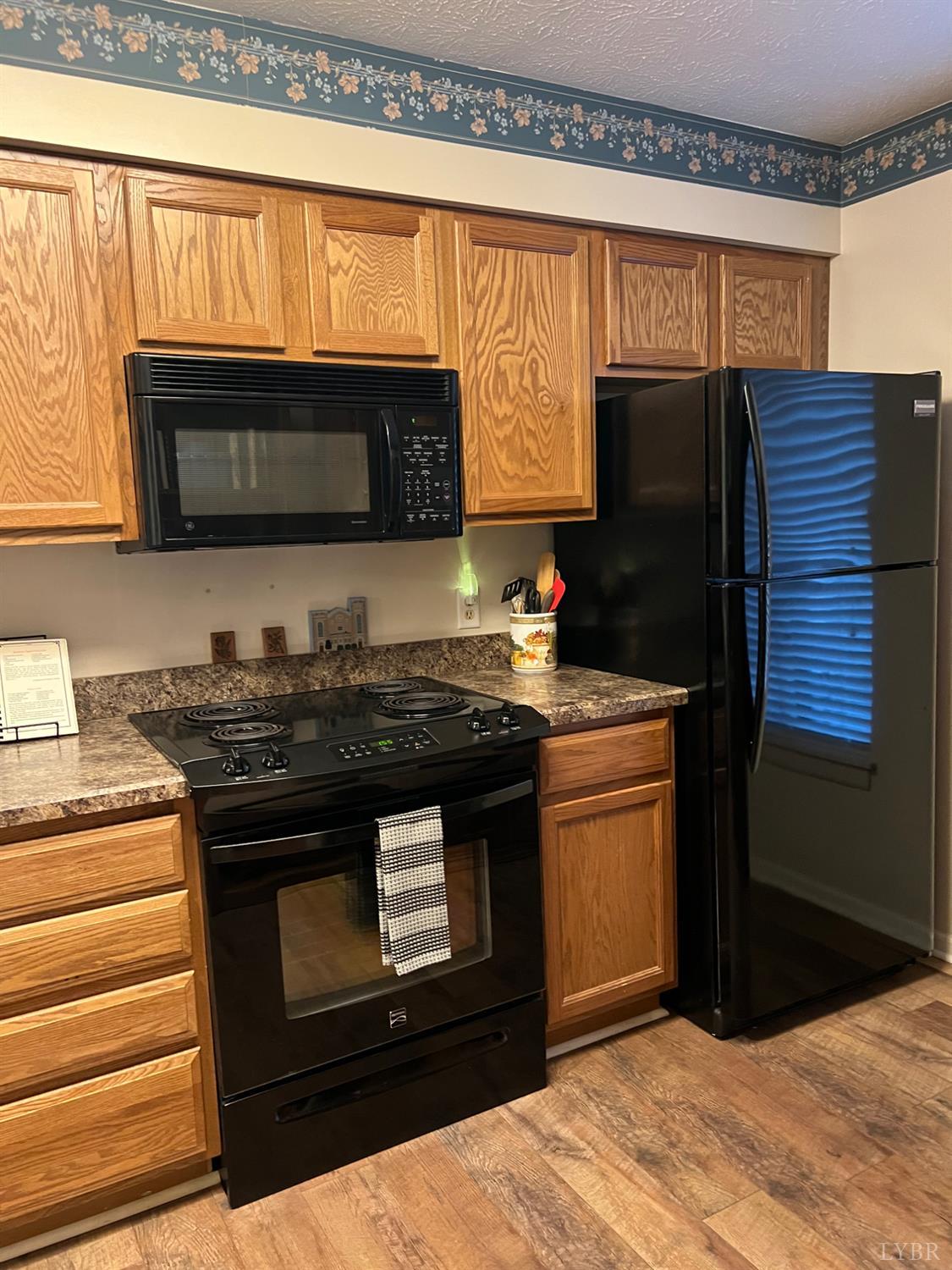 2212 Deer Run Forest, VA 24551 - Photo 25 of 38 a kitchen with granite countertop a stove and a microwave