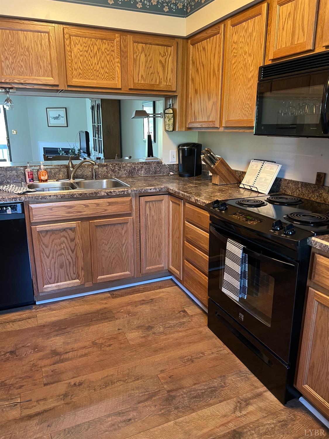 2212 Deer Run Forest, VA 24551 - Photo 29 of 38 a kitchen with stainless steel appliances granite countertop a stove a sink and a microwave