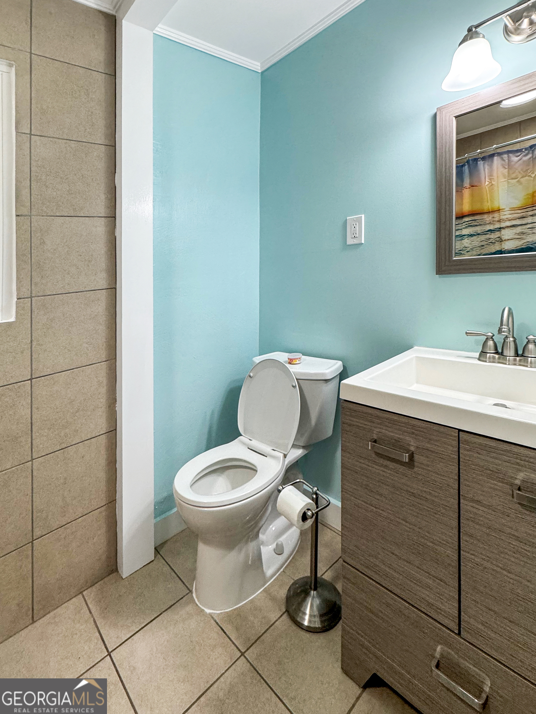 514 Highway 18 Barnesville, GA 30204 - Photo 12 of 15 a bathroom with a toilet sink and mirror