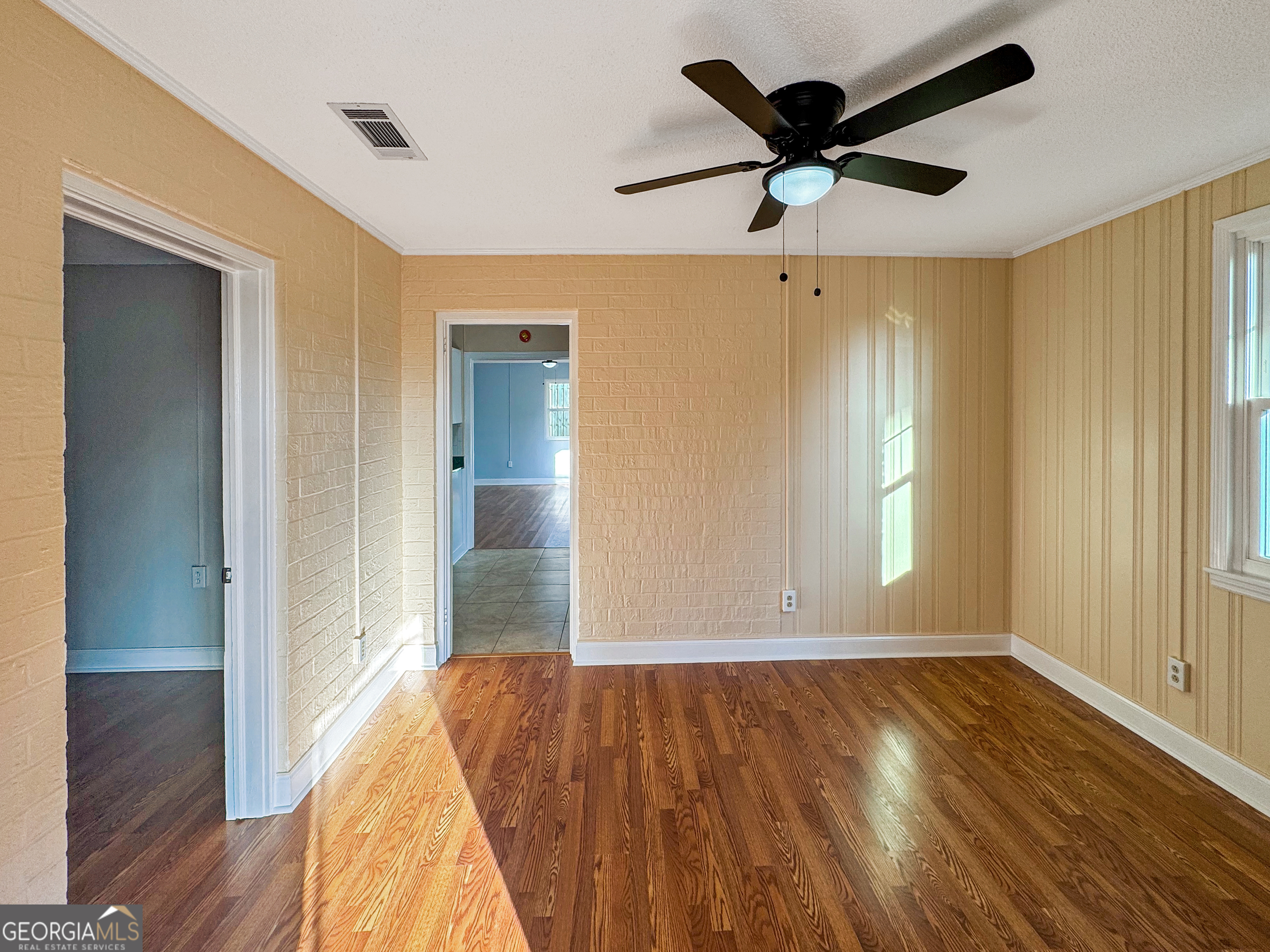 514 Highway 18 Barnesville, GA 30204 - Photo 2 of 15 a view of empty room with wooden floor and fan