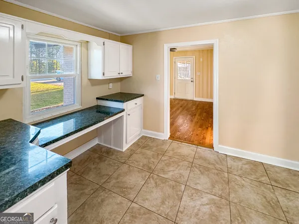 a kitchen with stainless steel appliances granite countertop a sink and a stove