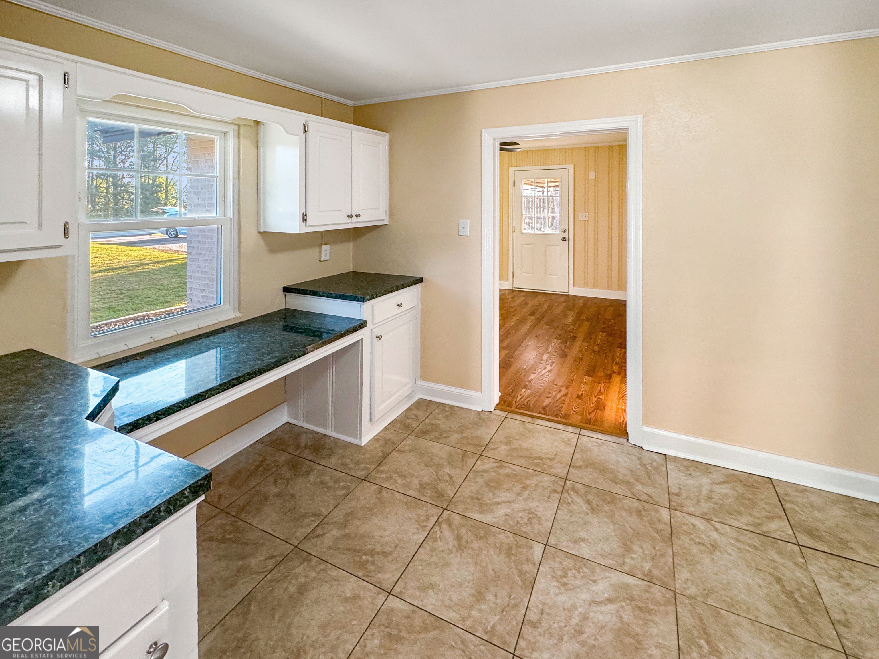 514 Highway 18 Barnesville, GA 30204 - Photo 5 of 15 a kitchen with stainless steel appliances granite countertop a sink and a stove